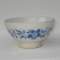 Ancien bol à côtes sur piédouche décor frise de fleurs bleues